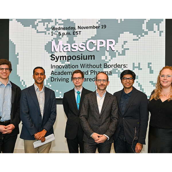 MassCPR symposium sign with group two keynote and science speakers posing for group photo