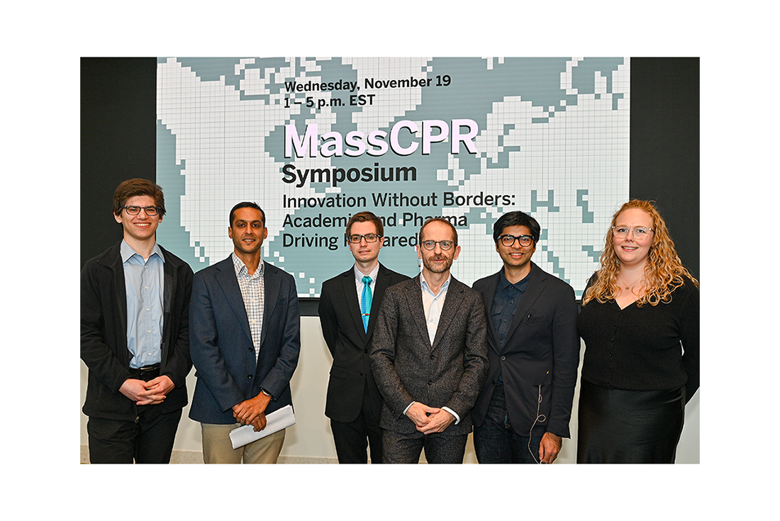 MassCPR symposium sign with group two keynote and science speakers posing for group photo