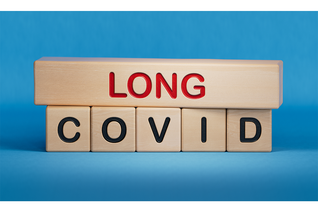 Blocks stacked with LONG on top and COVID spelled out across on individual blocks