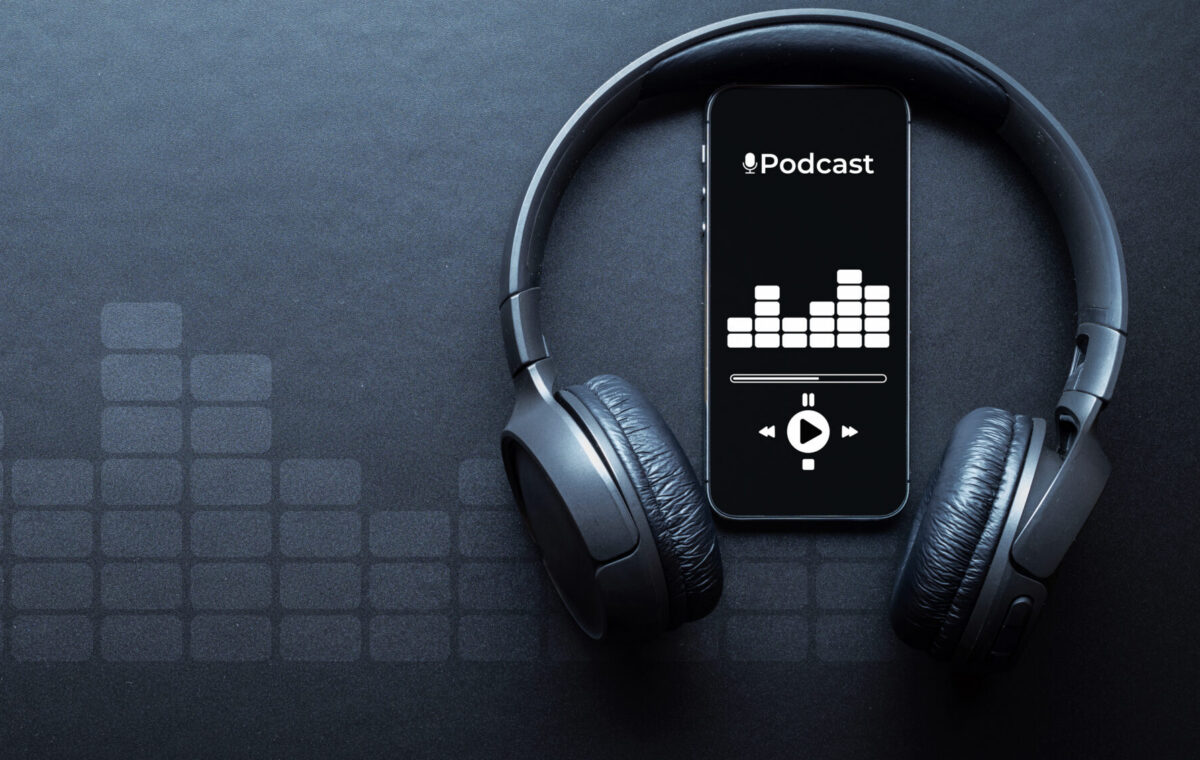 Mobile smartphone screen with podcast application, sound headphones.