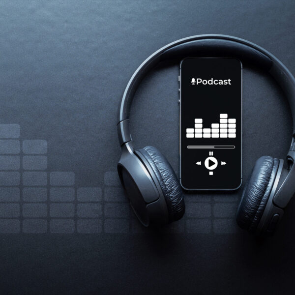 Mobile smartphone screen with podcast application, sound headphones.